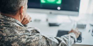 A military officer using a computer