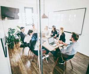 A group of people inside a conference room